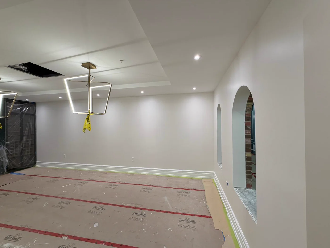Bright room with arched openings and chandelier